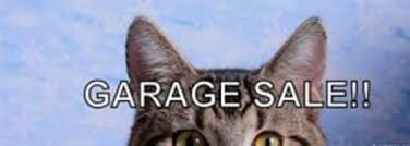 garage sale sign with cat